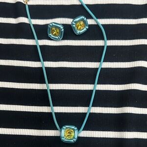 Swarovski Blue Necklace with Yellow Accents on Striped Dress